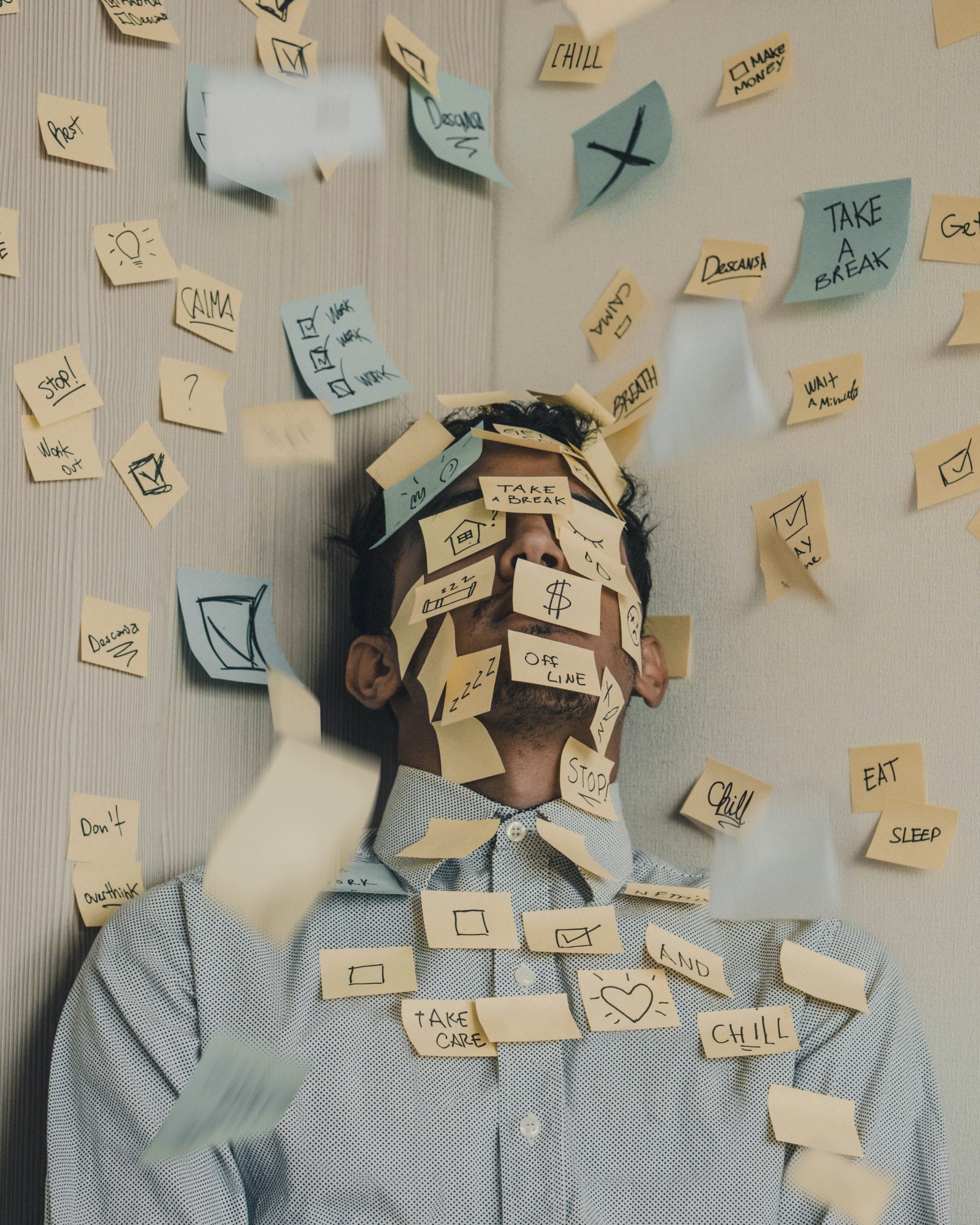 Man with post it notes on his face